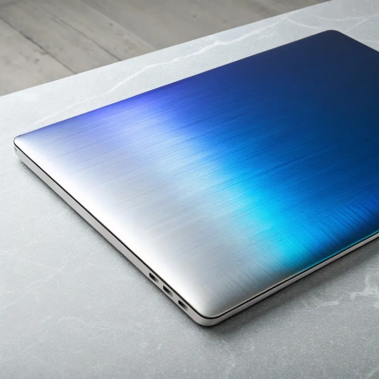 Gradient blue brushed metal laptop lid
